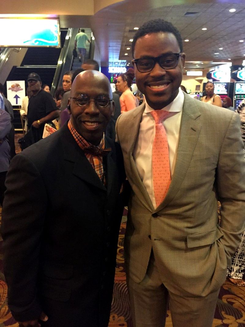 Doc Lewis with a friend in a tan suit and orange tie
